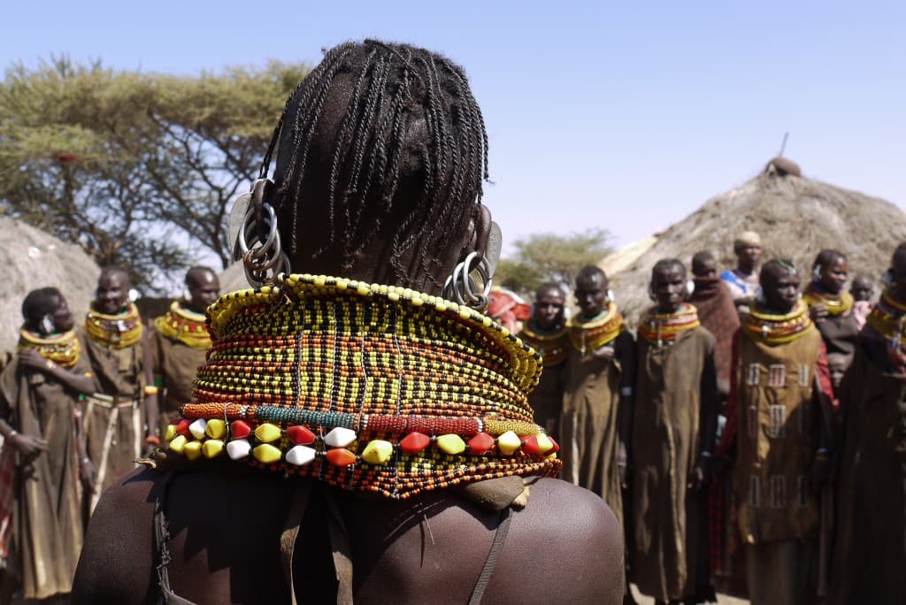 Imported plastic and manufactured beads dominant; handmade natural beads increasingly rare